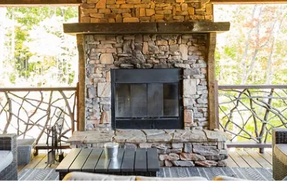 Outdoor seating area with stone fireplace